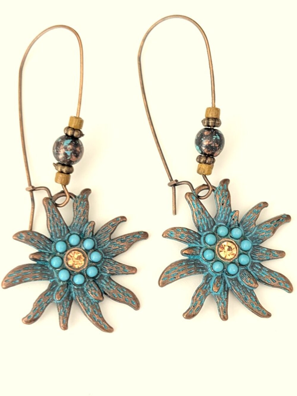 Flower drop earrings with patina coating
